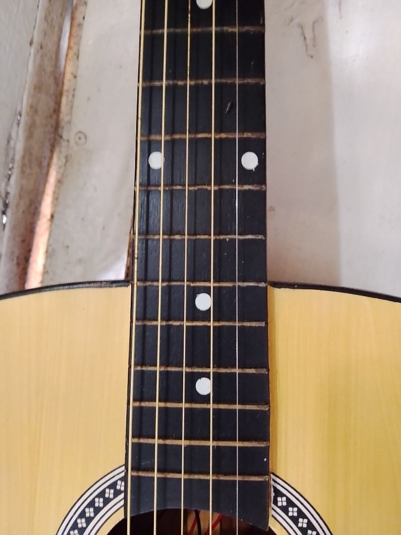 Acoustic-Electric Guitar with Pickup and Controls (Category: Musical Instruments) located in Caloocan City. Submitted by zealdragon_3dcff5 (Listing ID 1452820198, Image 2). Description: - Natural wood acoustic-electric guitar - Built-in pickup system - Volume and tone control knobs - Output jack at the bottom - Ready for practice or performance - Great for beginners and experienced players - Negotiable - need to change strings.