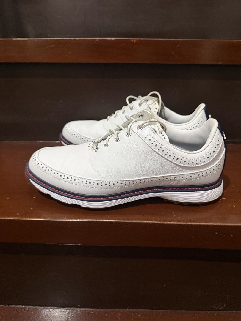 Adidas Golf Shoes MC80 Spikeless (Category: Sneakers) located in Makati City. Submitted by qualityseconds (Listing ID 1452825760, Image 2). Description: - White leather Adidas golf shoes - Classic wingtip brogue style - Navy and red trim along the sole - Comfortable for the golf course - Size: 8.5 US -only used twice on the golf course - No issues (really love it, very comfy but size is small) RFS: small for me.
