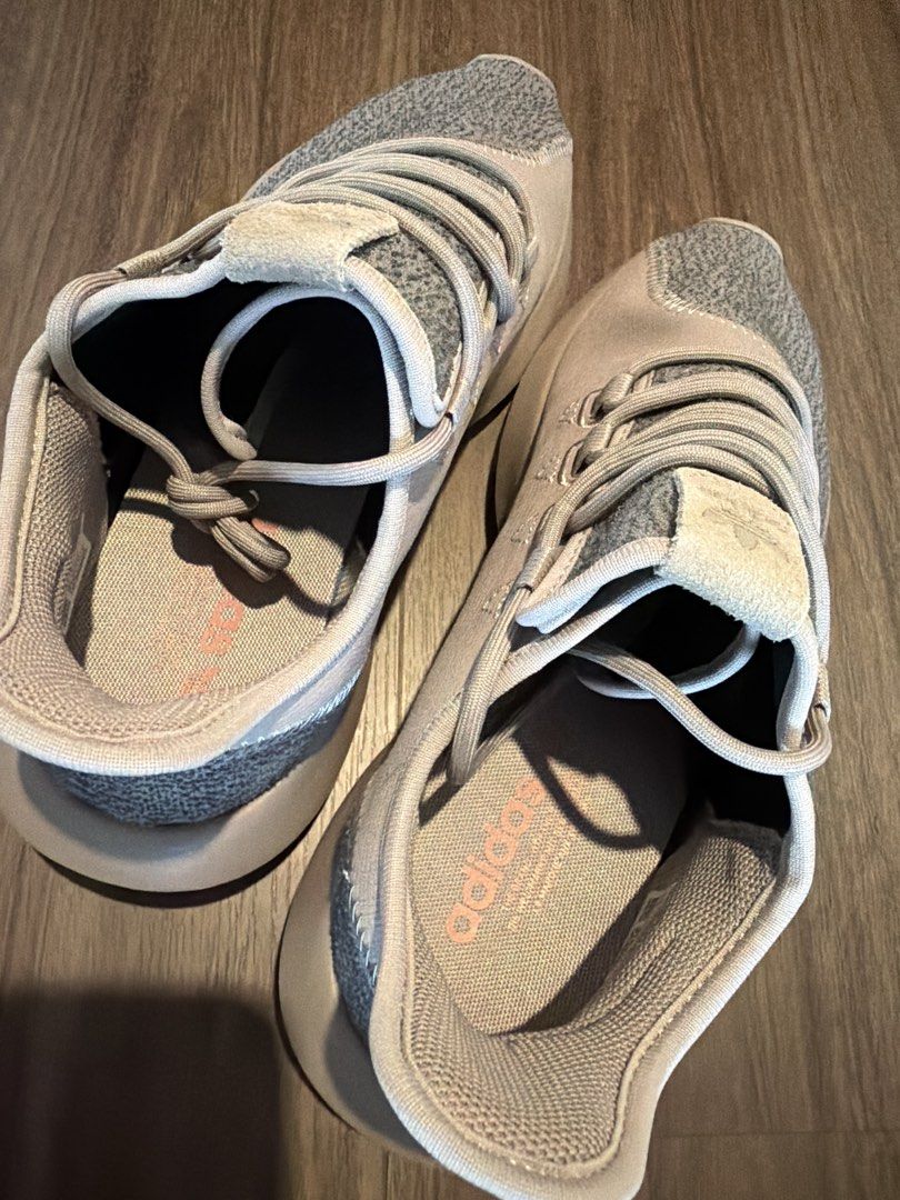 Adidas Sneakers (Category: Sneakers) located in Singapore. Submitted by mooonlightingg (Listing ID 1452783708, Image 3). Description: - Brand: Adidas - Size: EU 43 / US 9.5 - Color: Grey with light pink accents - Material: Breathable knit-like upper - Design: Modern lacing system, sock-like fit - Condition: Brand New .