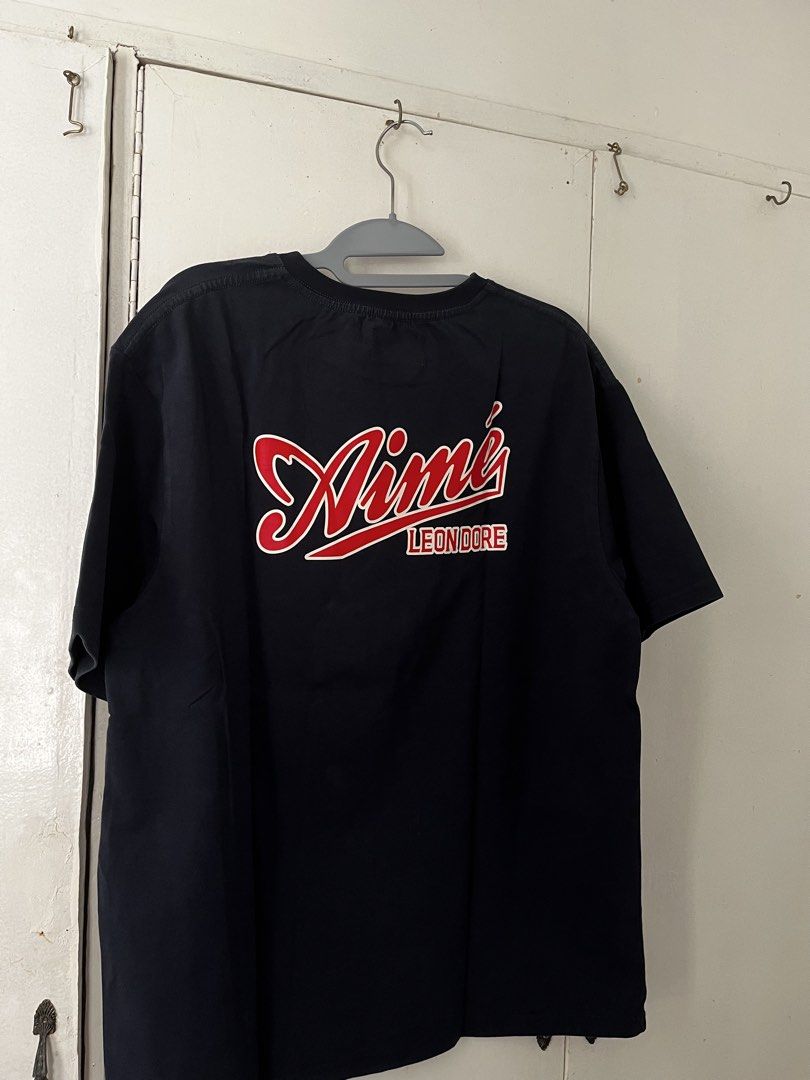 Aimé Leon Dore Graphic Shirt (Category: Tshirts & Polo Shirts ) located in Manila. Submitted by jojo_declutter (Listing ID 1452779352, Image 2). Description: - Aimé Leon Dore Graphic Shirt - Size XL on tag - Dimes: 21x27 - Color Rate: 10/10 - no issues! gcash payment only lalamove or j&t shipping qc loc dm for info!.
