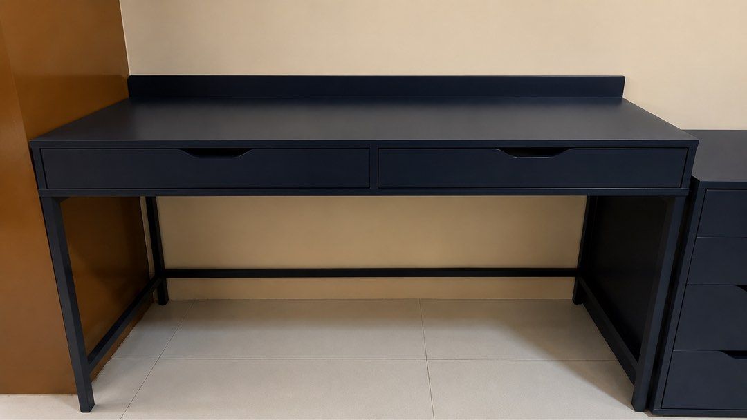 Alex desk Dark Blue Desk with Two Drawers (Category: Tables & Sets) located in Paranaque City. Submitted by second_dance_ph (Listing ID 1452722052, Image 1). Description: - Dark blue desk - Two drawers with smooth gliding action - Built-in power outlet for convenience - Ideal for study or work spaces - Built-in cable management for collecting cables and cords out of sight but close at hand. Drawer stops prevent the drawers from being pulled out t