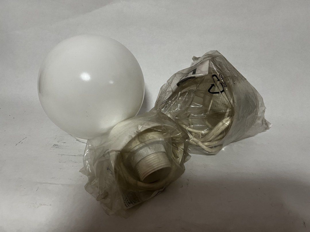 Assorted lighting parts (Category: Lighting) located in Singapore. Submitted by apombalek (Listing ID 1452750737, Image 1). Description: - White glass globe lamp cover (screw-on) - IKEA white plastic ceiling cap for pendant light (2 types), comes with cord and socket, still in original packaging - Unused even though dusty (was in storage for a while) - To be taken as a whole lot, no choosing of individual pieces.