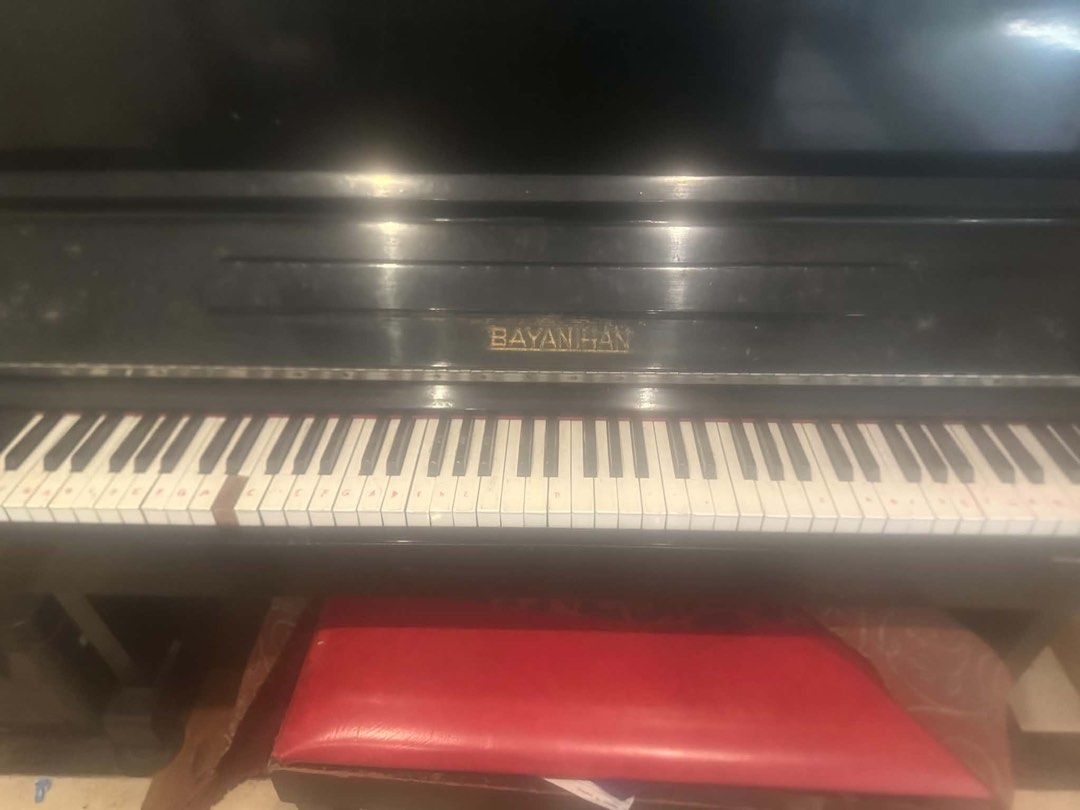 BAYAN HAN Upright Piano (Category: Musical Instruments) located in Quezon City. Submitted by sjlsrolling (Listing ID 1452800518, Image 2). Description: - BAYAN HAN upright piano - Black finish - Some keys have slight discoloration - Includes red piano bench - Ideal for practice or beginners - Requires tuning - Pick up only.