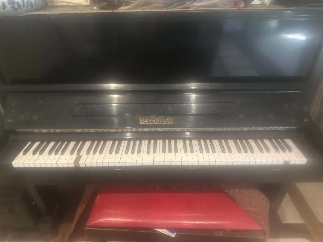 BAYAN HAN Upright Piano (Category: Musical Instruments) located in Quezon City. Submitted by sjlsrolling (Listing ID 1452800518, Image 3). Description: - BAYAN HAN upright piano - Black finish - Some keys have slight discoloration - Includes red piano bench - Ideal for practice or beginners - Requires tuning - Pick up only.