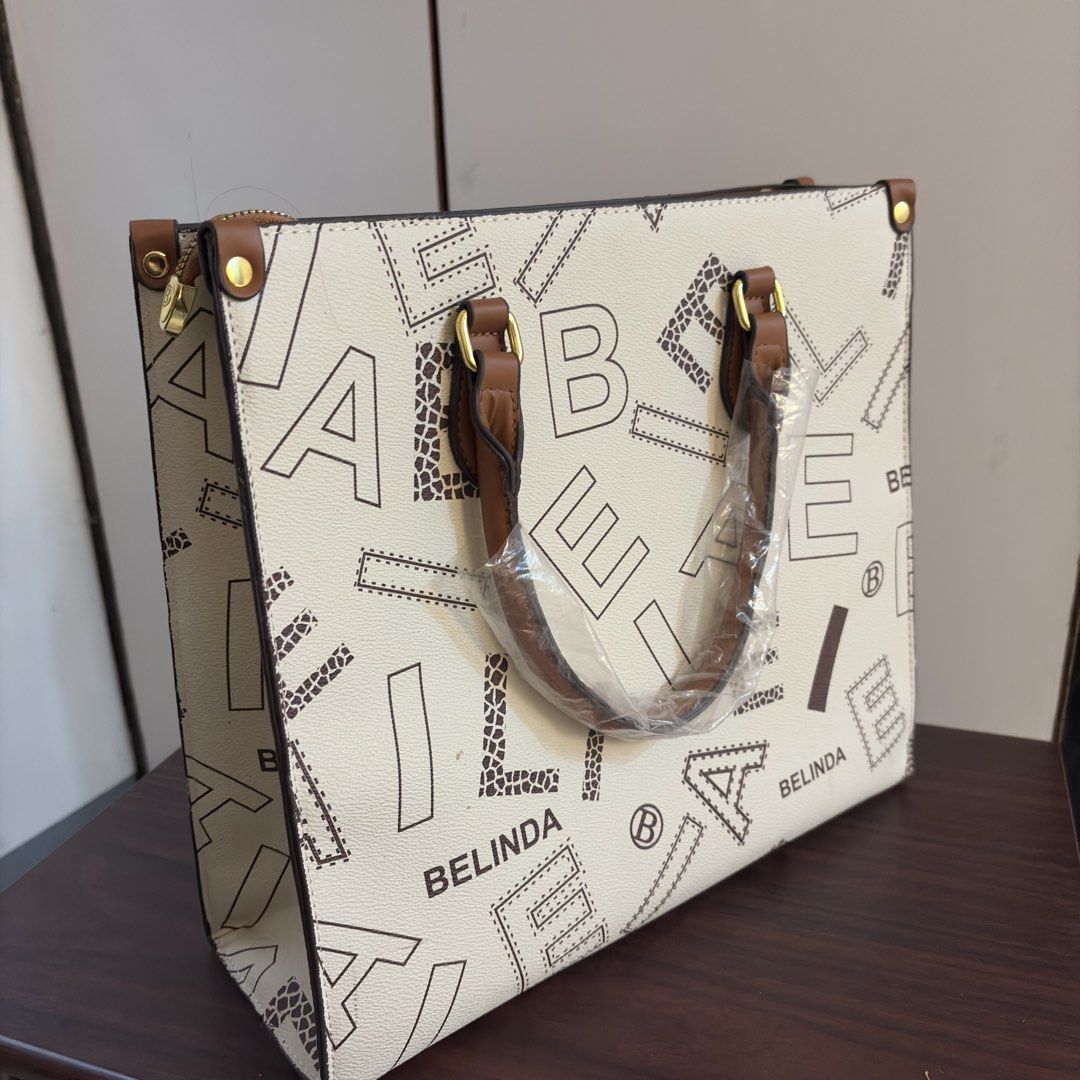 Belinda Structured Tote Bag (Category: Tote Bags) located in Malvar. Submitted by chatztash (Listing ID 1452796419, Image 1). Description: Brand: Belinda Material: Synthetic PU leather Hard Leather and structure bag perfect as versatile office, formal, everyday, commuter bag - with detachable straps Brand new with plastic seal.