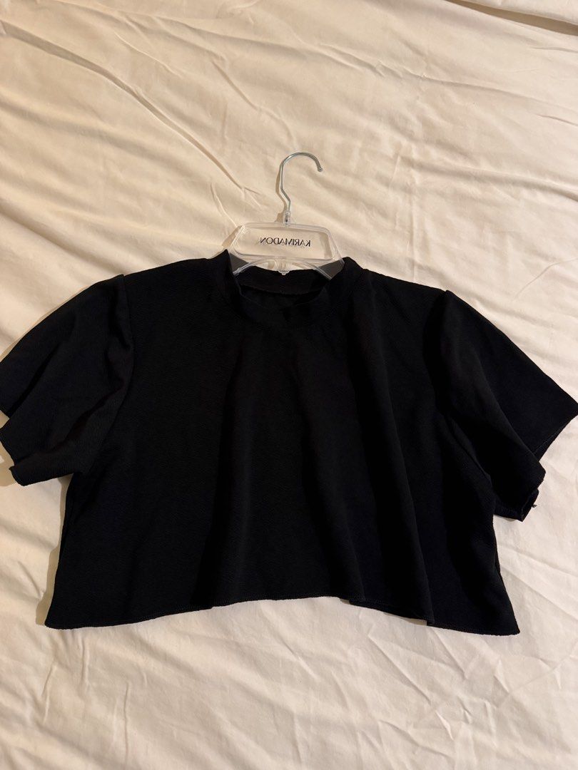 Black Cropped Top Shirt (Category: Shirts) located in Quezon City. Submitted by ianne.declutter (Listing ID 1452832715, Image 2). Description: - Black cropped t-shirt - Mock neck design - Short, fluttery sleeves - Subtle textured fabric pattern - Length measurement: approximately 16 inches - Perfect basic piece for any outfit.