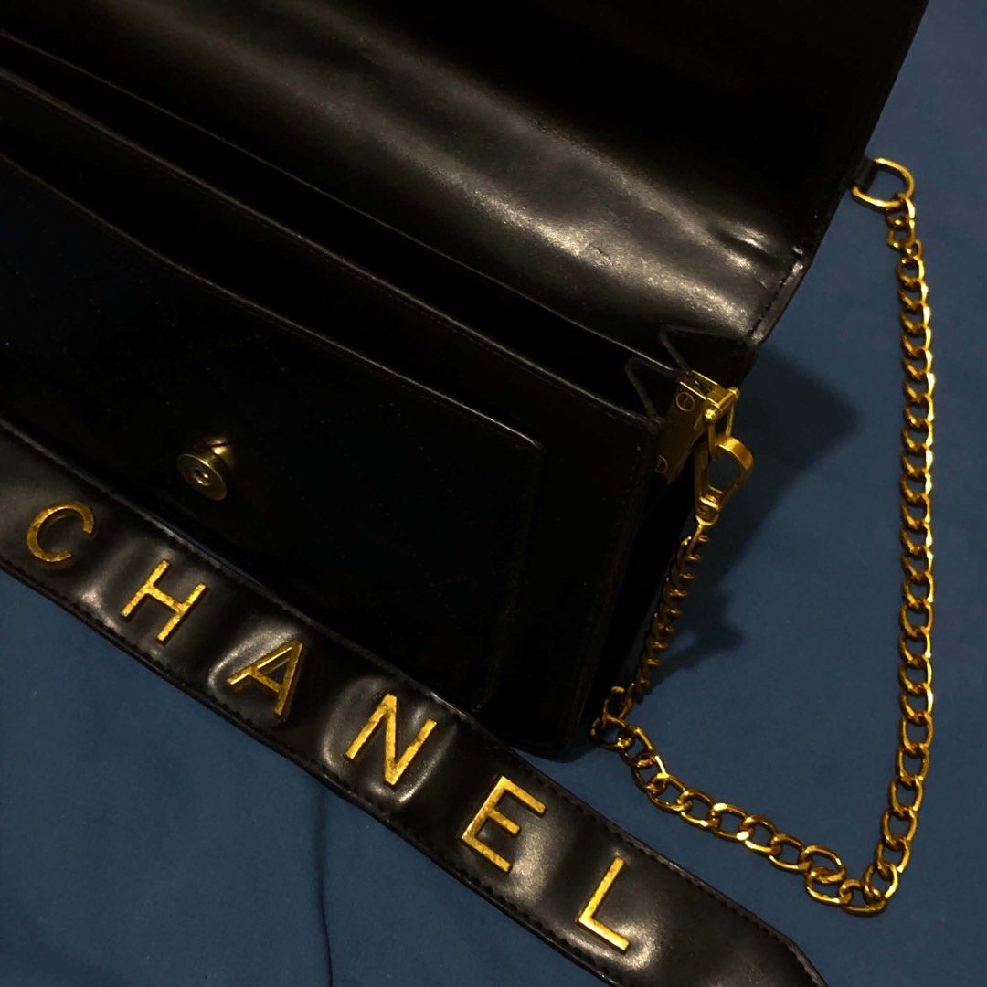 Black Quilted Handbag with Gold Chain and Strap (Category: Luxury Bags & Wallets) located in Mandaluyong City. Submitted by emmbisyosa (Listing ID 1452839674, Image 3). Description: - Stylish black quilted handbag - Comes with a gold chain strap - Includes a separate black strap with gold 'CHANEL' lettering - Secure magnetic snap closure - Features multiple interior compartments - Ideal for evening events and going out -used twice in an event -RF