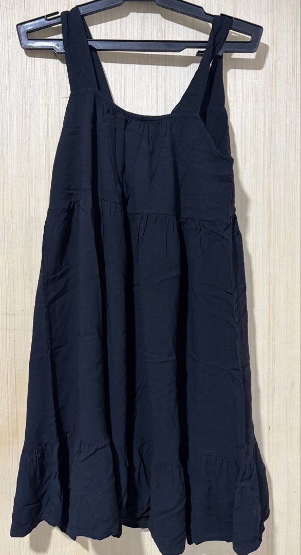 Black Ruffle Hem Mini Dress (Category: Dresses) located in Pasay City. Submitted by a.daneee (Listing ID 1452835734, Image 2). Description: - Black mini dress - Spaghetti straps - Tiered design with ruffle hem - Comfortable and casual - Ideal for warm weather - Versatile for dressing up or down.