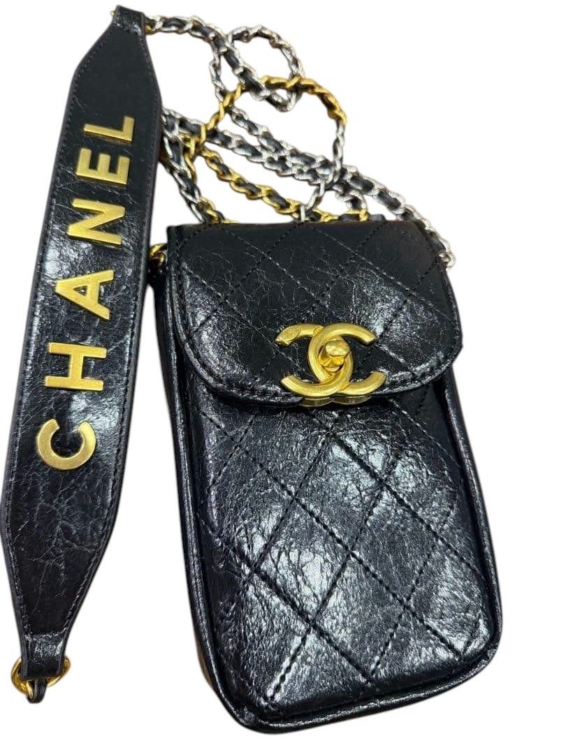 Chanel Phone Pouch Sling (Category: Luxury Bags & Wallets) located in Makati City. Submitted by allgoodsthrifts (Listing ID 1449216690, Image 1). Description: - Authentic Chanel makeup, phone sling pouch - Verified by Grailed App ( see 2nd pic or you can check on my Grailed Shop i also posted it there) - Height 17.5cm, Width 10.5cm, Depth 4.0cm - Can fit small to big phone - Quilted black leather - Gold hardware - Iconic CC logo - Detachable chai