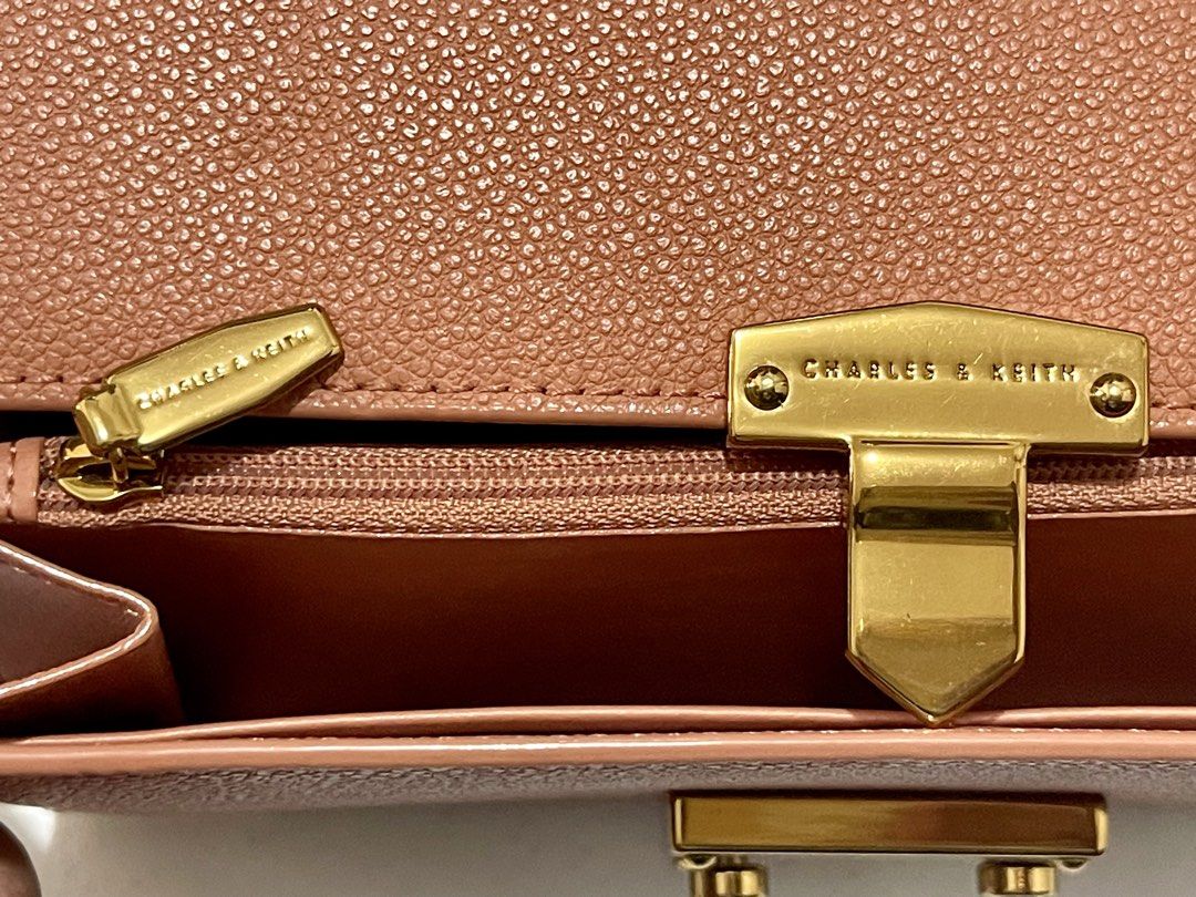 Charles & Keit Wallet on Chain (Slightly Negotiable) (Category: Wallets & Card holders) located in Imus. Submitted by cheratedfinds (Listing ID 1452755665, Image 3). Description: Charles & Keith Pearl Accent Push-Lock Chain Wallet Crossbody Bag - Dusty Rose Pink A sleek and functional piece in textured pebbled faux leather with elegant gold-tone hardware and pearl push-lock detailing. Features a detachable gold chain strap so you can wear it as a