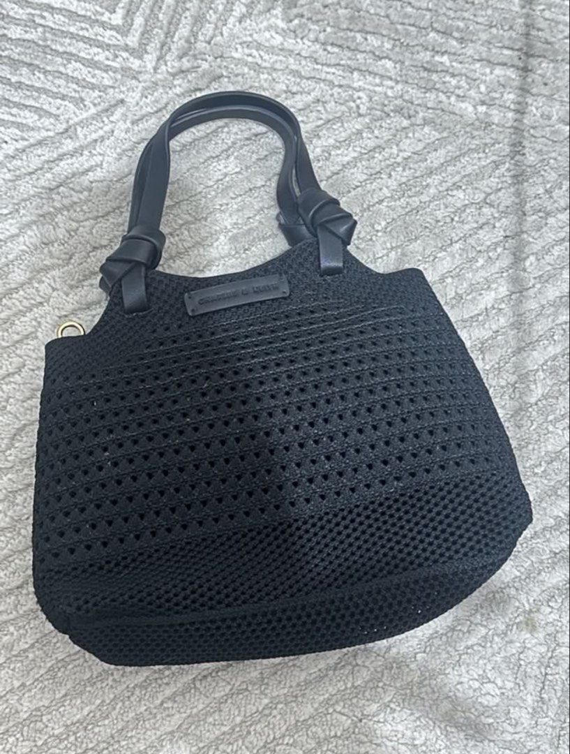 Charles & Keith Black Woven Tote Bag (Category: Tote Bags) located in Caloocan City. Submitted by _amyy_ (Listing ID 1452727153, Image 2). Description: - authentic, got in sg way back - very nice and lightweight. - perfect for everyday and summer - rfs: decluttering. not my brand anymore - no flaws. MOP: BPI SF shouldered by the buyer.