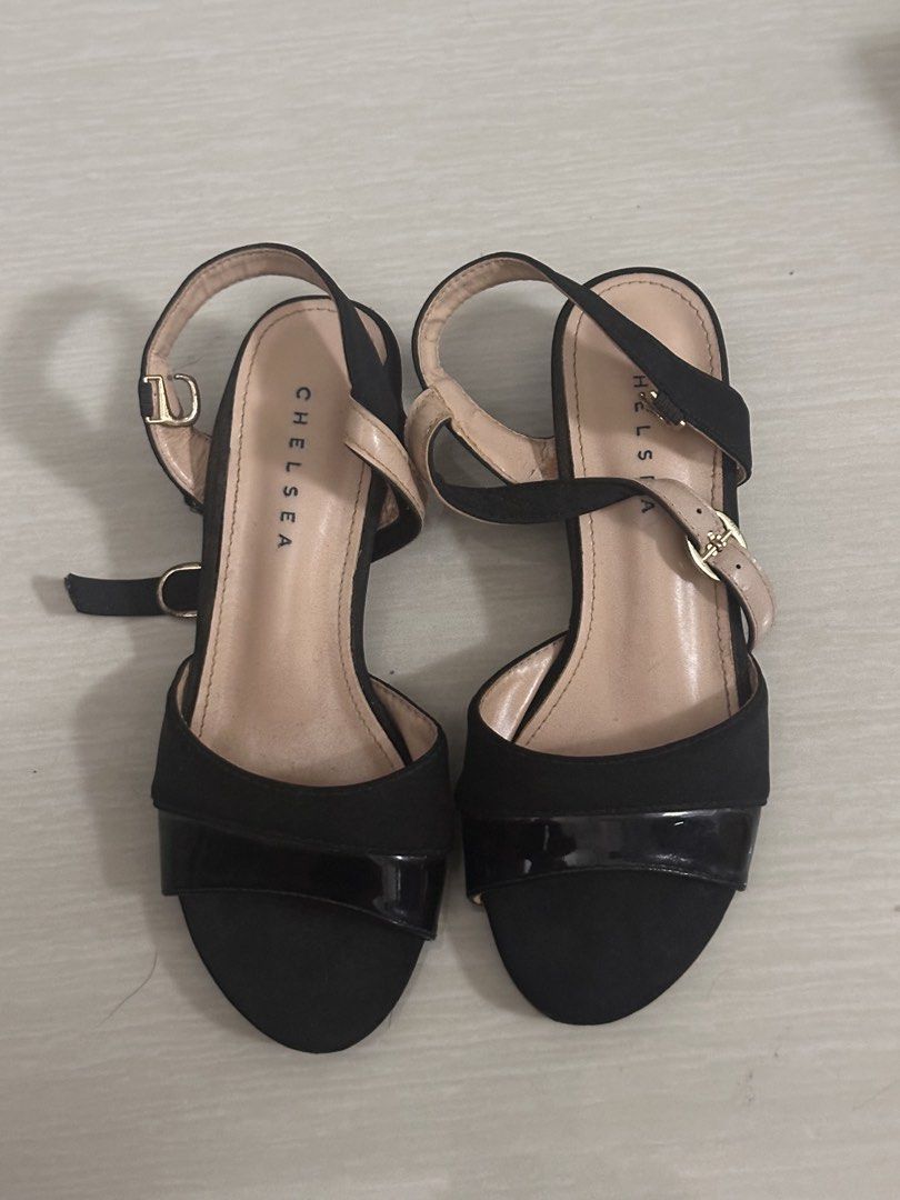Chelsea Black Block Heel Sandals with Ankle Strap (Category: Heels) located in Pasay City. Submitted by a.daneee (Listing ID 1452844937, Image 1). Description: - Chic black block heel sandals - Features a glossy patent toe strap - Secure and adjustable ankle strap - 'CHELSEA' brand subtly displayed on the insole - Comfortable heel height, ideal for all-day wear - Versatile design: dress up or down effortlessly.