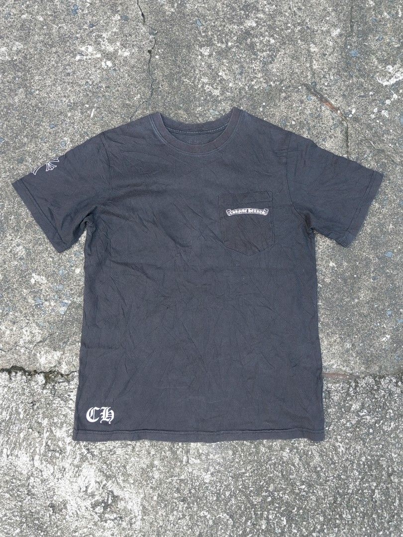 Chrome Hearts Pocket T-Shirt (Category: Tshirts & Polo Shirts ) located in Las Pinas. Submitted by huslerz (Listing ID 1452768999, Image 1). Description: - Black Chrome Hearts T-shirt - Iconic cross graphic on the back - Pocket logo detail - Small 'CH' detail at the hem - Minor flaw: tiny hole on the front (visible in the last photo) - Ideal for everyday casual wear 20x27.5.