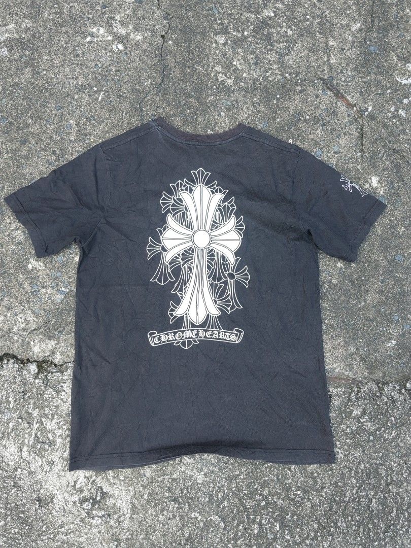 Chrome Hearts Pocket T-Shirt (Category: Tshirts & Polo Shirts ) located in Las Pinas. Submitted by huslerz (Listing ID 1452768999, Image 2). Description: - Black Chrome Hearts T-shirt - Iconic cross graphic on the back - Pocket logo detail - Small 'CH' detail at the hem - Minor flaw: tiny hole on the front (visible in the last photo) - Ideal for everyday casual wear 20x27.5.