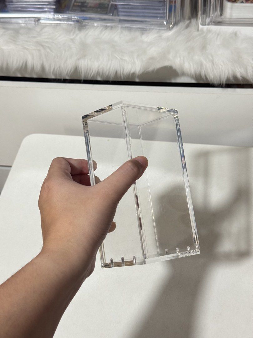 Clear Acrylic Display Box for Collectibles (Category: Storage Boxes & Baskets) located in Manila. Submitted by mo_onchaser (Listing ID 1452822955, Image 2). Description: Originally bought for 500 (July 2026) RFS: Extra stock - Transparent acrylic box - Ideal for displaying trading cards and small collectibles - Protects items from dust - Sturdy construction - Stackable for efficient storage.