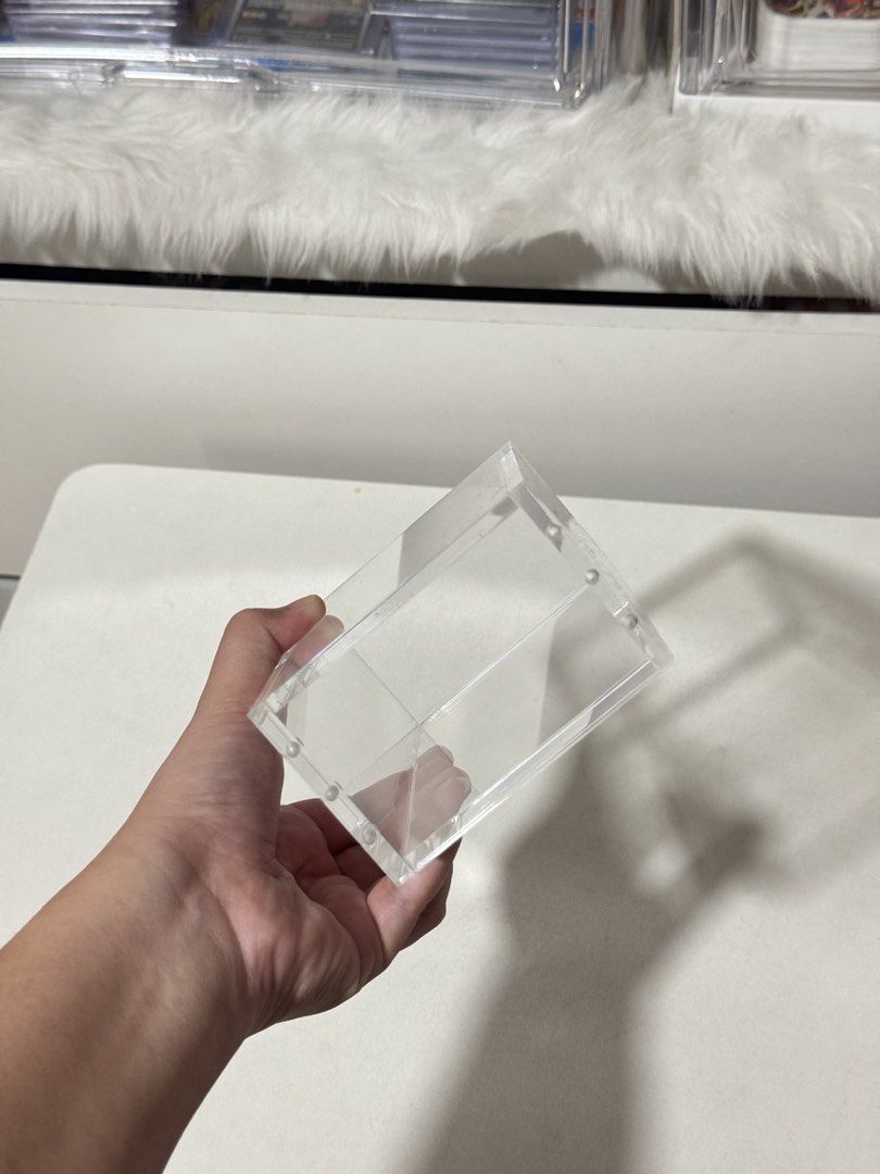 Clear Acrylic Display Box for Collectibles (Category: Storage Boxes & Baskets) located in Manila. Submitted by mo_onchaser (Listing ID 1452822955, Image 3). Description: Originally bought for 500 (July 2026) RFS: Extra stock - Transparent acrylic box - Ideal for displaying trading cards and small collectibles - Protects items from dust - Sturdy construction - Stackable for efficient storage.