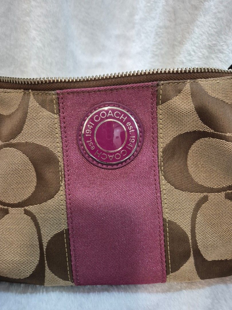 Coach Signature Stripe Demi Shoulder (Category: Luxury Bags & Wallets) located in Cebu City. Submitted by chocowaffol (Listing ID 1452761256, Image 2). Description: - Authentic Coach pouch - Classic brown and tan signature C monogram canvas - Interior features a small zippered pocket - Leather patch with serial number inside - Made in Vietnam -Can be sling and or shoulder bag .