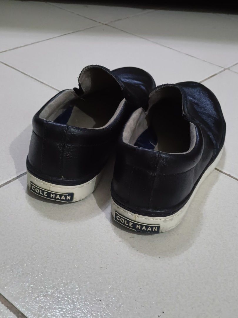 Cole Haan Slip-On Leather Sneakers (Category: Casual Shoes) located in Makati City. Submitted by tabsilog (Listing ID 1452813808, Image 3). Description: - Brand: Cole Haan Falmouth Grand OS - Type: Slip-on sneakers - Material: Black leather - Features: Grand.OS comfort technology - Sole: Cole Haan logo - Best for: Casual wear - Condition: Shows some signs of wear on soles and leather, but plenty of life left. price neg.