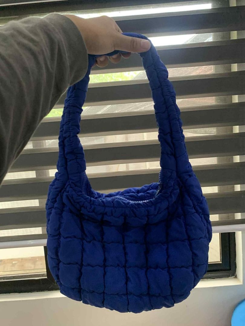 COS Quilted Bag Blue(Small) (Category: Shoulder Bags) located in Las Pinas. Submitted by dhliacmp (Listing ID 1452859105, Image 3). Description: - Blue quilted bag from COS - Puffy, soft material - Zipper closure - Comfortable shoulder strap - Ideal for everyday use - Fits essentials - Easy to carry - Stylish and modern look - Adds a pop of color to any outfit.