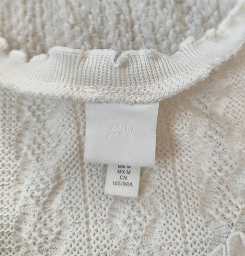 Cream Cable Knit Cropped Blouse – Coquette Style (Category: Blouses) located in Kalibo. Submitted by cloth.ly (Listing ID 1452724621, Image 3). Description: Original Price: ₱600 (bought sa mall) 💸 Resell Price: ₱350+ SF (Shipping Fee c/o Buyer) • Brand: H&M • Color: Soft Cream / Off‑white • Style: Cropped, cable knit texture, scalloped/ruffle edges, pearl‑look buttons – super cute coquette / soft girl aesthetic! • Fabric: Lightweight, breathable