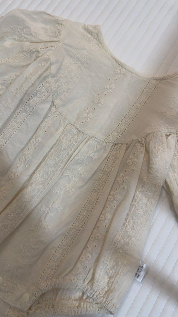 Cream Eyelet Lace Long Sleeve Baby Romper (Category: Babies & Kids Fashion) located in Abucay. Submitted by kmdqs (Listing ID 1452856721, Image 2). Description: - Cream colored baby romper - Delicate eyelet lace details all over - Long puff sleeves with elastic cuffs - Convenient snaps at the bottom for easy diaper changes - Made of soft and breathable 100% cotton - Size 66.