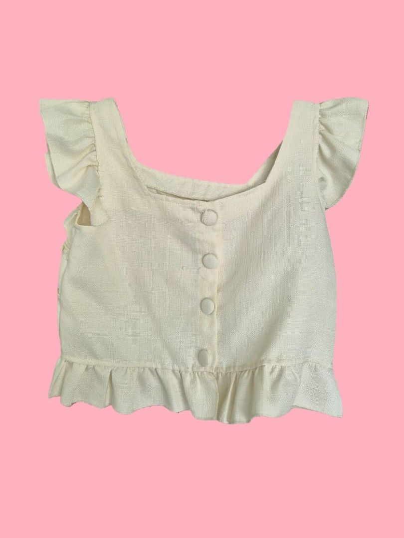 Cream Square Neck Ruffle Sleeve Button Up Crop Top (Category: Blouses) located in Manila. Submitted by vimcorpuz (Listing ID 1452837108, Image 1). Description: - Cream colored crop top - Soft tweed material - Best fits size Small to Medium .