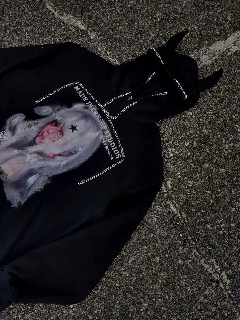 CRHSUP STUDIOS Black Devil Horn Hoodie (Category: Hoodies) located in Caloocan City. Submitted by supreme-619 (Listing ID 1452784283, Image 2). Description: - CRHSUP STUDIOS black hoodie - FIT; Large to X-Large - Features a big graphic print of a girl with white hair and devil horns on the hood - Chain detail across the chest - Ribbed cuffs and hem.