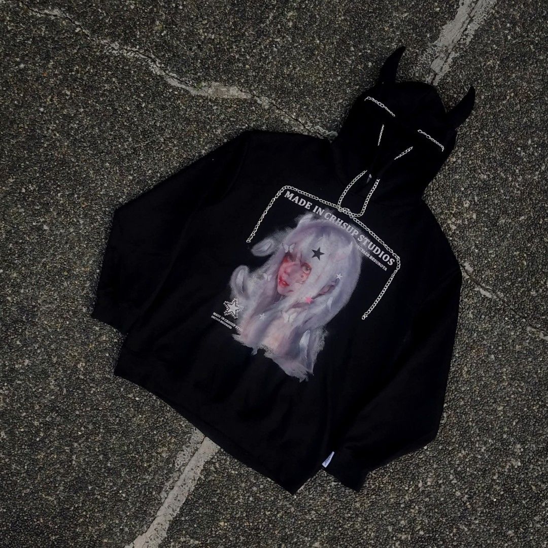 CRHSUP STUDIOS Black Devil Horn Hoodie (Category: Hoodies) located in Caloocan City. Submitted by supreme-619 (Listing ID 1452784283, Image 1). Description: - CRHSUP STUDIOS black hoodie - FIT; Large to X-Large - Features a big graphic print of a girl with white hair and devil horns on the hood - Chain detail across the chest - Ribbed cuffs and hem.