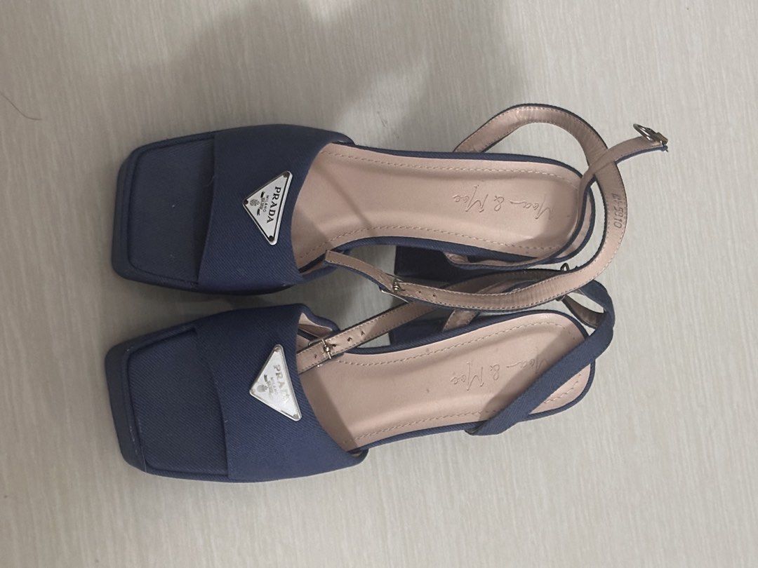 Denim Blue Block Heel Sandals (Category: Heels) located in Pasay City. Submitted by a.daneee (Listing ID 1452844799, Image 1). Description: - Stylish blue canvas sandals - Comfortable block heel with substantial height - Secure ankle strap with buckle closure - Trendy square toe design - Brand logo visible on insole and front strap - Great for walking and everyday wear.