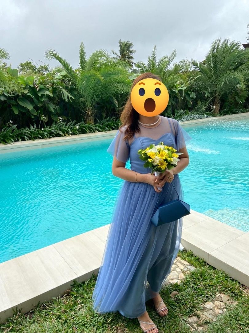 Dusty Blue Bridesmaid Gown (Category: Evening dresses & gowns) located in Bulacan. Submitted by makristeenkoleen (Listing ID 1452805476, Image 1). Description: - Dusty Blue color - With free clutch bag (shown in the photo) - Ideal for formal events, weddings, photoshoots - Comfortable and flowy design.
