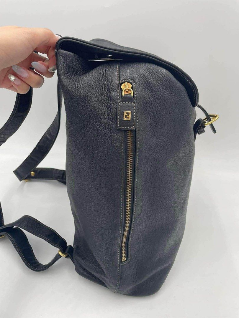 Fendi Black Leather Backpack with Gold Buckle (Category: Backpacks) located in Cainta. Submitted by ginamit (Listing ID 1452700439, Image 2). Description: - Classic black genuine leather backpack - Flap closure with gold buckle and strap - Convenient zippered side pocket for easy access - Spacious interior with an additional zippered pocket - Ideal for everyday use or travel ***100% authentic. Full refund plus ₱5,000 if the item is confirmed coun