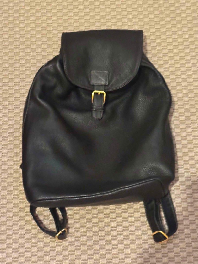 Fendi Black Leather Backpack with Gold Buckle (Category: Backpacks) located in Cainta. Submitted by ginamit (Listing ID 1452700439, Image 3). Description: - Classic black genuine leather backpack - Flap closure with gold buckle and strap - Convenient zippered side pocket for easy access - Spacious interior with an additional zippered pocket - Ideal for everyday use or travel ***100% authentic. Full refund plus ₱5,000 if the item is confirmed coun