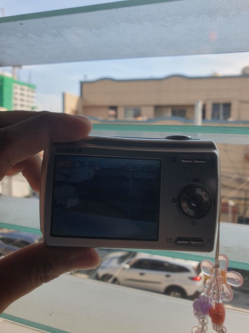 Fujifilm Finepix F100fd (Category: Cameras) located in Manila. Submitted by repurposinglover (Listing ID 1452863983, Image 2). Description: [RUSH] FUJIFILM FINEPIX F100fd Specifications Body Type: Compact Effective pixels: 12 megapixels Sensor type: CCD LCD size: 2.7″ LCD dots: 230000 px Shortest exposure time: 1/1500 sec USB - Port 1: USB 2.0 hi-speed (480 Mbit/sec) Weight: 210 g Aperture priority: No ApertureRange maximum: 5.1 ApertureRange min