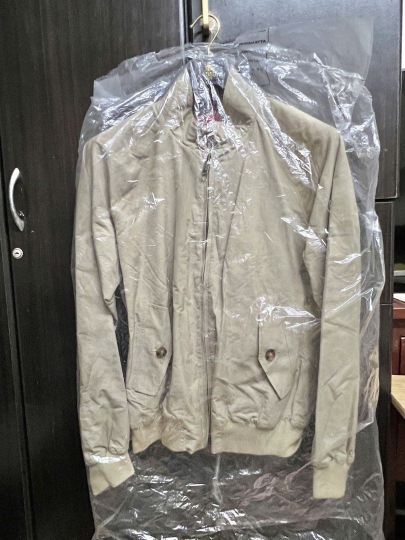 Weekend SALE! G9 Baracuta Harrington Jacket Tan Plaid Lined Size 42 (Category: Coats, Jackets and Outerwear) located in Santa Rosa. Submitted by chindeclutters (Listing ID 1452830191, Image 2). Description: - G9 Baracuta Classic Harrington Jacket - Features a stylish tartan plaid lining. - Two front pockets with button flaps. - Ribbed cuffs and hem for a comfortable fit. - Perfect for casual outfits or layering. - Size: 42 - used once, can still 