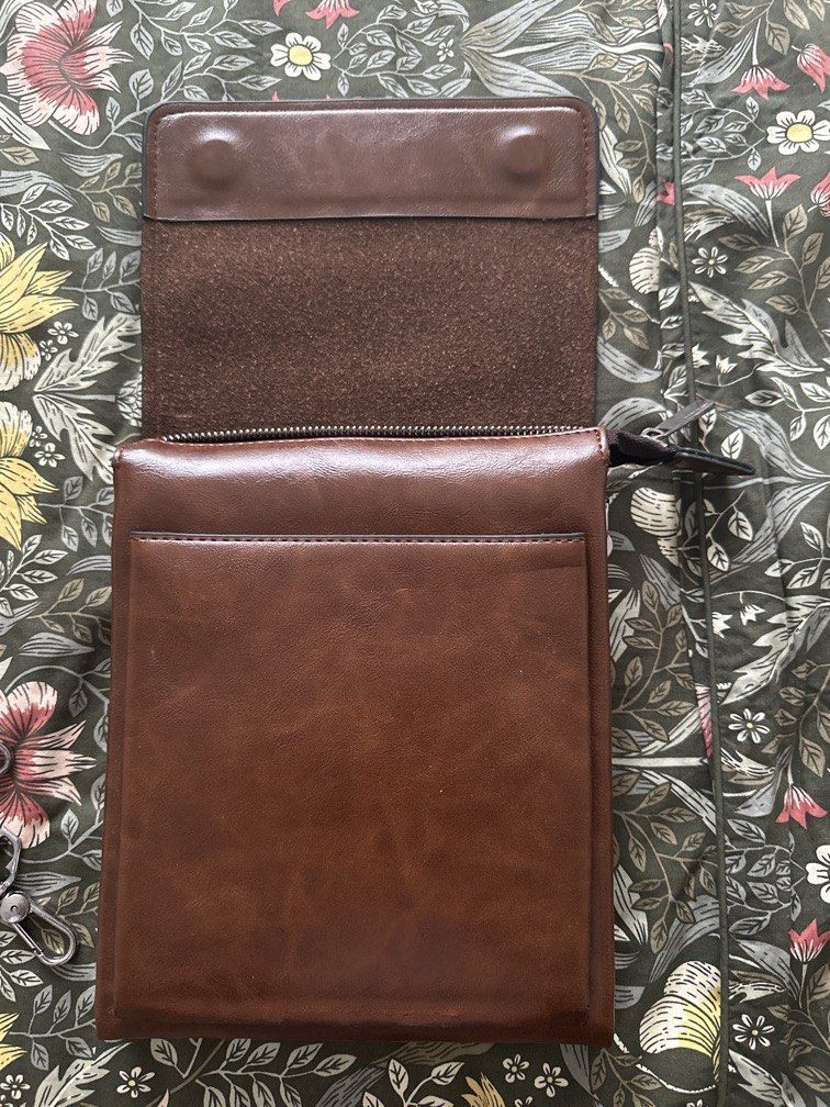 Giorgio Armani Brown Leather Bag (Category: Luxury Bags & Wallets) located in Makati City. Submitted by macalinaojr (Listing ID 1452387605, Image 3). Description: - Genuine Giorgio Armani brown leather - Features iconic embossed eagle logo on front flap - Simple and sleek design - Perfect for organizing essentials - Compact size - 7/10 due to faux leather.