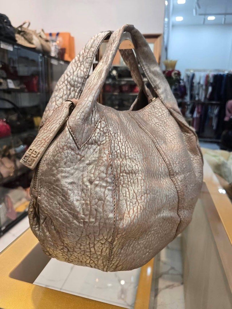 Givenchy Metallic Gold Hobo Bag Authentic💯 (Category: Luxury Bags & Wallets) located in Davao. Submitted by preloveditems21davao (Listing ID 1452759613, Image 2). Description: Medium size With generic dustbag.