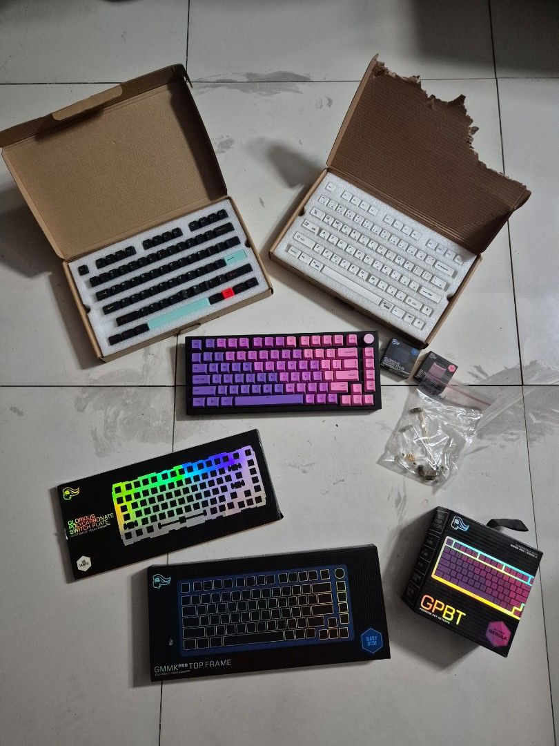 Glorious GMMK Pro w/ Accessories (Keyboard Set) (Category: Computer Keyboard) located in Taguig. Submitted by chadsgarage (Listing ID 1452859254, Image 1). Description: Inclusions: -Glorious GMMK Pro (Black) -Glorious GMMK Pro Top Frame (Navy Blue) - Set of Glorious GMMK Pro rotary knobs (Pink & Navy Blue) - GPBT PBT Keycaps in Nebula colorway - Glorious Polycarbonate Switch Plate - Includes modded stabilizers - All items in original packaging (e