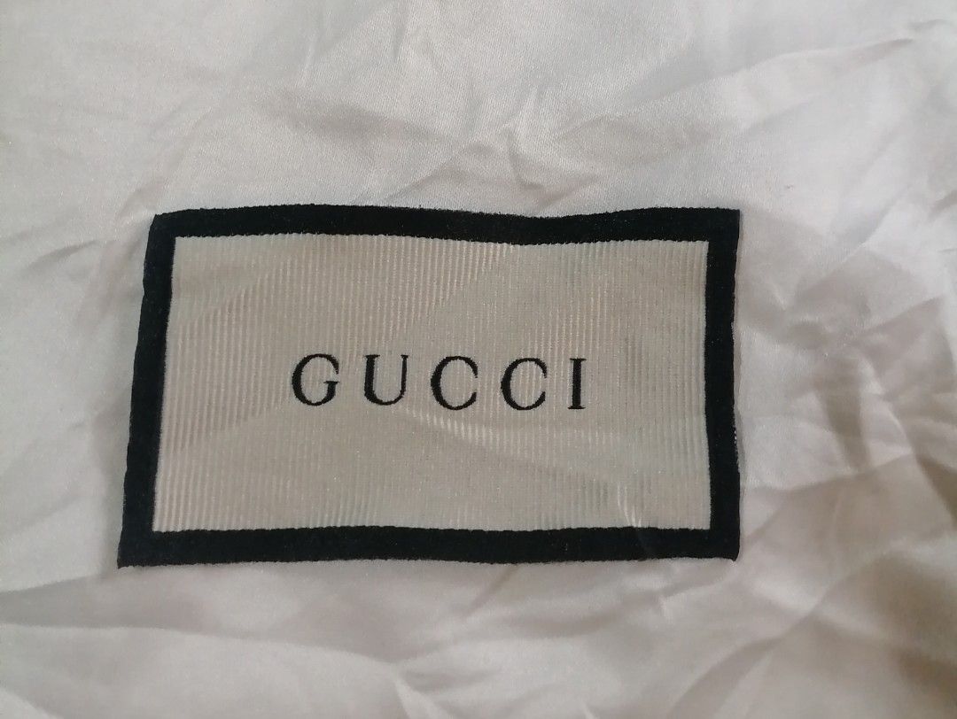 Gucci Dust Bag 17"h x 8"w (Category: Luxury Bags & Wallets) located in Cagayan de Oro. Submitted by emma3782 (Listing ID 1452778280, Image 2). Description: - Authentic Gucci dust bag - White fabric with classic Gucci logo - Ideal for storing shoes or accessories - Protects valuables from dust and damage - Keeps items clean and pristine.