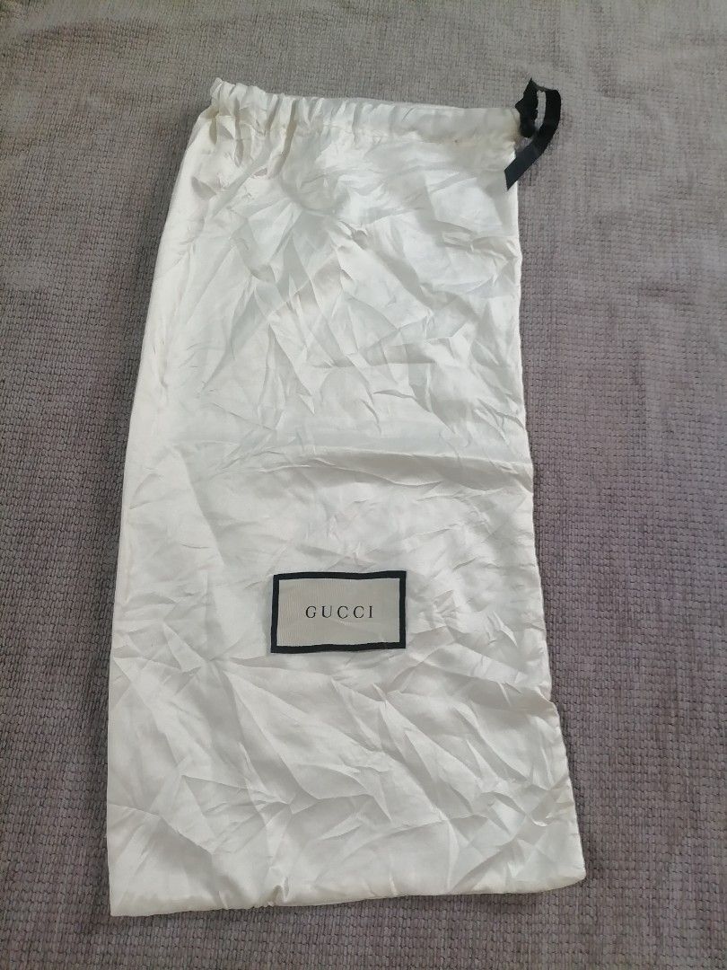 Gucci Dust Bag 17"h x 8"w (Category: Luxury Bags & Wallets) located in Cagayan de Oro. Submitted by emma3782 (Listing ID 1452778280, Image 1). Description: - Authentic Gucci dust bag - White fabric with classic Gucci logo - Ideal for storing shoes or accessories - Protects valuables from dust and damage - Keeps items clean and pristine.