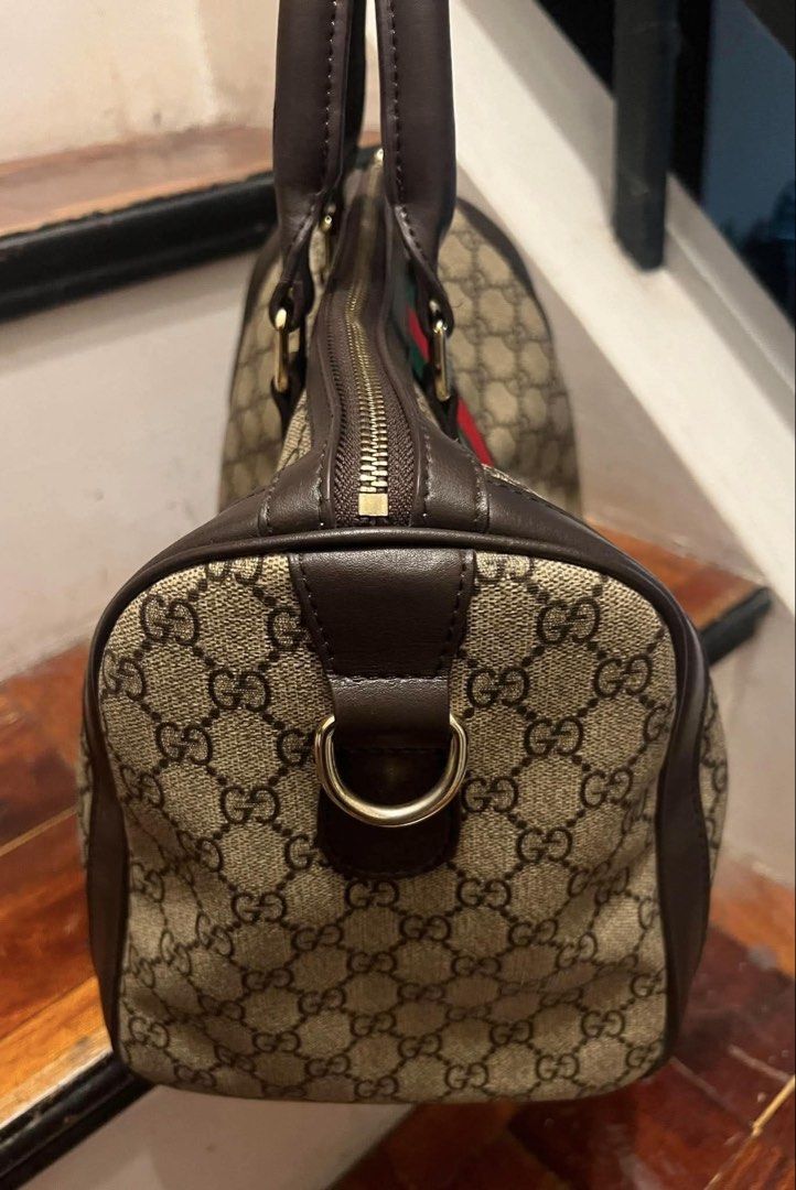 Gucci Monogram Canvas & Leather Stripe Boston Bag (Category: Luxury Bags & Wallets) located in Muntinlupa City. Submitted by mj.finds (Listing ID 1452808757, Image 3). Description: - Gucci Boston Bag - Classic GG monogram canvas - Signature green and red stripe detail - Interior zip pocket with minor marks - Serial number visible inside - Ideal for everyday use.