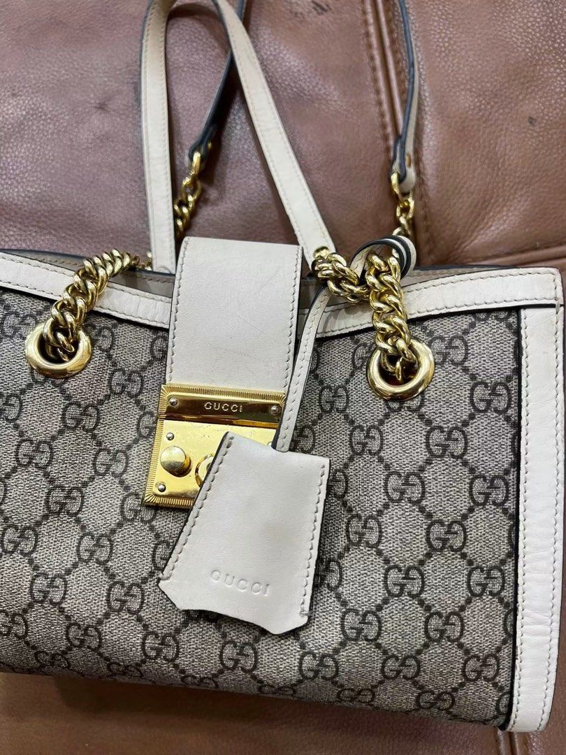 Gucci Padlock GG Supreme Canvas Shoulder Bag (Category: Luxury Bags & Wallets) located in Bacolod City. Submitted by novymaesel14868 (Listing ID 1452826250, Image 2). Description: - Authentic Gucci shoulder bag - Classic GG Supreme canvas (beige/ebony) - Cream leather trim - Gold-tone hardware - Secure lock closure - Chain strap for shoulder wear - Clean interior - Includes leather tag - Versatile for daily use or special occasions.