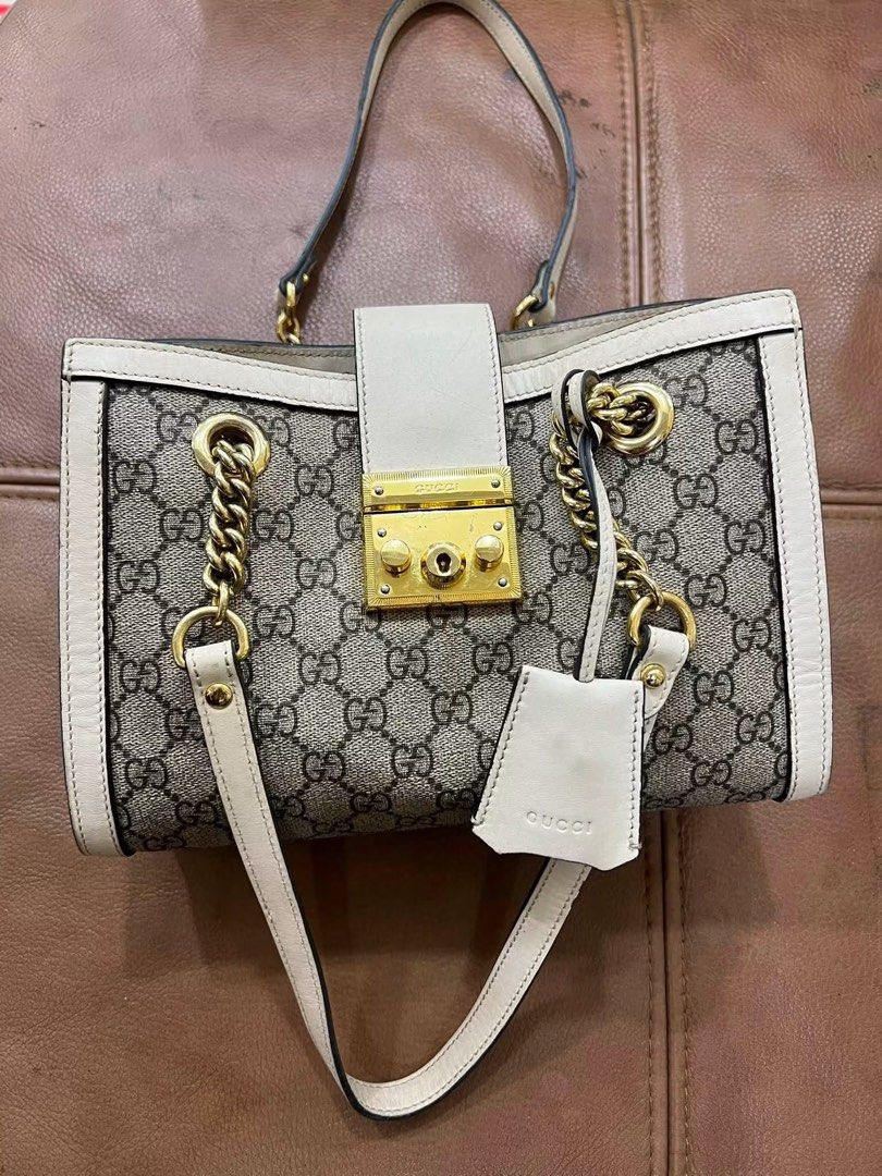 Gucci Padlock GG Supreme Canvas Shoulder Bag (Category: Luxury Bags & Wallets) located in Bacolod City. Submitted by novymaesel14868 (Listing ID 1452826250, Image 3). Description: - Authentic Gucci shoulder bag - Classic GG Supreme canvas (beige/ebony) - Cream leather trim - Gold-tone hardware - Secure lock closure - Chain strap for shoulder wear - Clean interior - Includes leather tag - Versatile for daily use or special occasions.