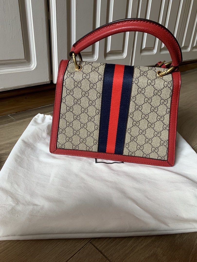 Gucci Queen Margaret Bag (Category: Luxury Bags & Wallets) located in Quezon City. Submitted by nikkigodmd (Listing ID 1452738301, Image 2). Description: - Iconic red and blue web stripe - Luxurious red leather trim - Cute 'Blind for Love' luggage tag - Spacious interior with multiple compartments - Secure interior zip pocket - Detachable strap for versatile styling - Elegant gold hardware details.