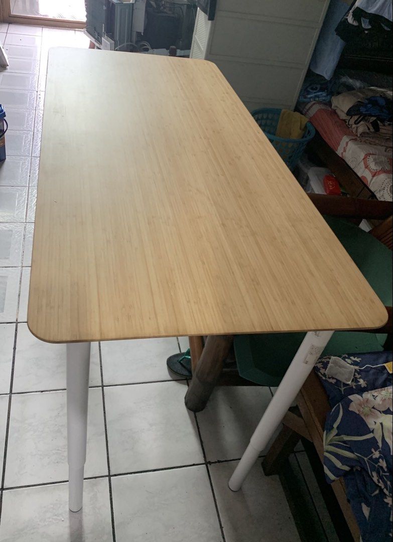 IKEA OLOV Table with Adjustable Legs (Category: Tables & Sets) located in Mandaluyong City. Submitted by lgariba (Listing ID 1452735907, Image 2). Description: - IKEA OLOV Table - Bamboo tabletop with smooth finish and rounded corners - White adjustable legs for customizable height - Versatile: Use as a desk or dining table - Easy to assemble and transport.