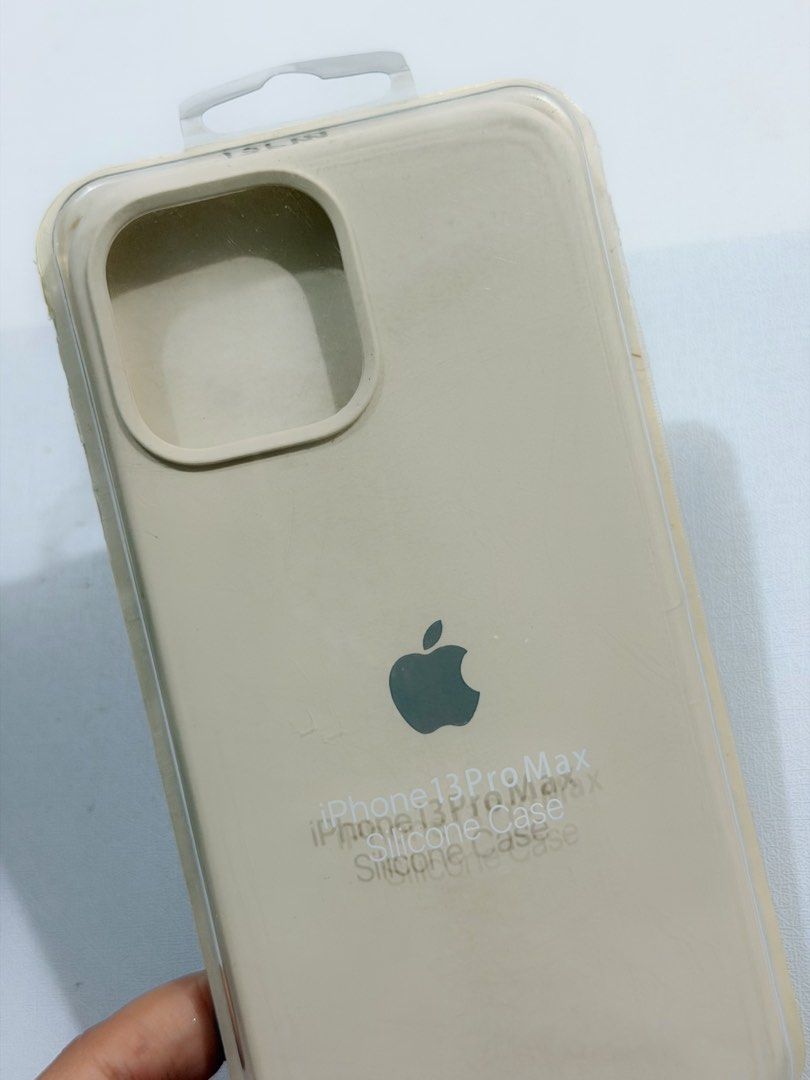 Iphone 13 Pro Max Silicone Case (Category: Cases & Sleeves) located in Manila. Submitted by closetbychristina (Listing ID 1452817973, Image 2). Description: - Genuine silicone case for iPhone 13 Pro Max - Elegant light beige/cream color - Soft touch and excellent grip - Protects your device from everyday wear and tear - Subtle embossed Apple logo.