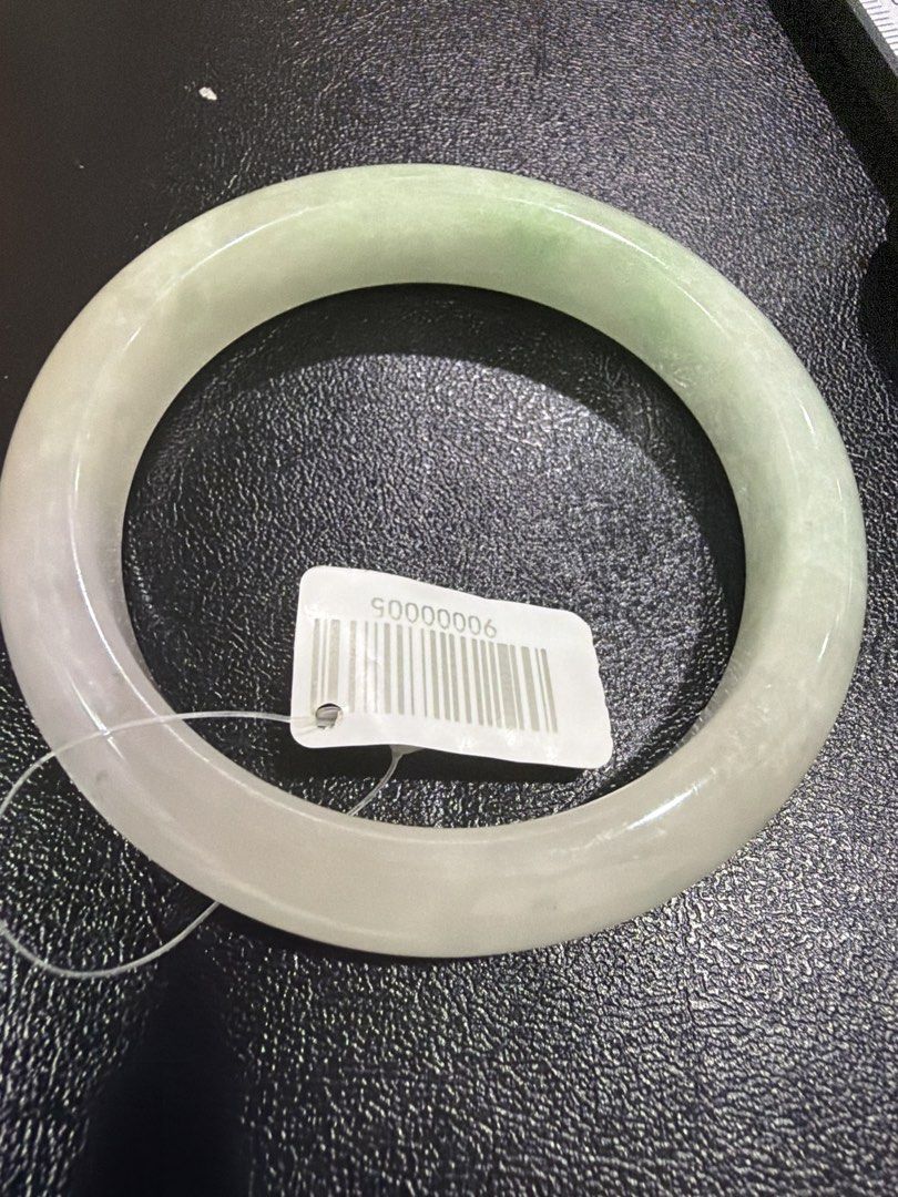 Jade bangle (Category: Bracelets) located in Singapore. Submitted by totetote123 (Listing ID 1452820534, Image 1). Description: Near translucent colour bangle… with tint of purple and light green dust bangle 548mm inner diameter .