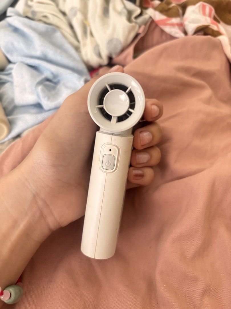 Jisulife Portable Handheld Fan Life 9 (Category: Fans) located in Manila. Submitted by kairs.preloved (Listing ID 1452700919, Image 2). Description: - Jisulife Portable Fan - Model Life 9 - Color: White - Features: Power button and adjustable speed dial - Power Source: Rechargeable battery - Benefits: Compact, easy to carry, perfect for personal cooling on the go - Condition: Minor scuffs from normal use.