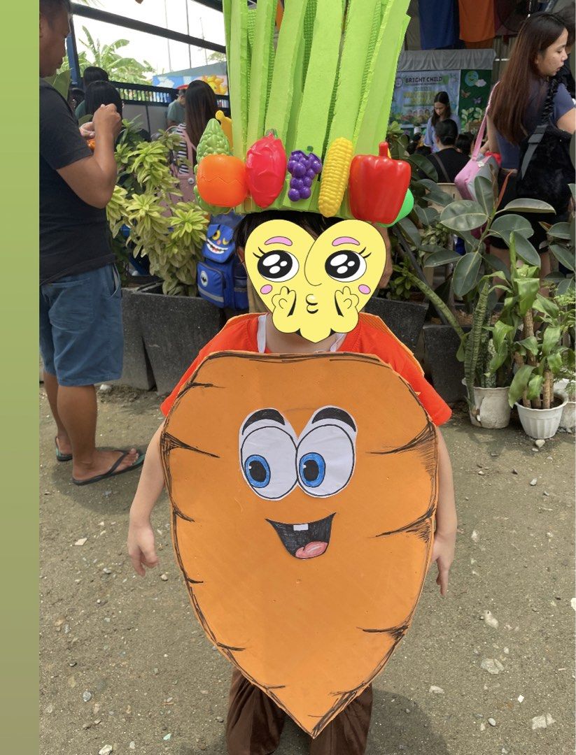 Kids Carrot Costume with Vegetable Headpiece (Category: Babies & Kids Fashion) located in Guiguinto. Submitted by beatan13 (Listing ID 1452770830, Image 1). Description: - Adorable carrot costume for children. - Comes with a vibrant vegetable-themed headpiece. - Ideal for school plays, Halloween, and costume parties. - Features an orange carrot body with a friendly face. - Headpiece includes colorful details like grapes, corn, and peppers. - Get 