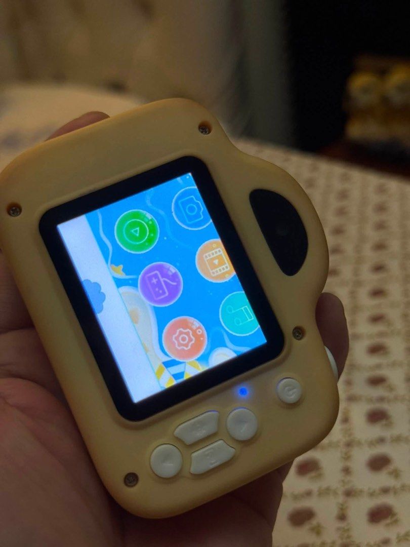 Kids Mini Digital Camera - Tested Working (Category: Cameras) located in Cainta. Submitted by elainelawenko (Listing ID 1452815238, Image 2). Description: - Tested yellow mini digital camera for kids. - Fully functional: takes photos and features a screen with icons. - Rechargeable via micro USB (charger not included). - Ideal for children to discover photography..