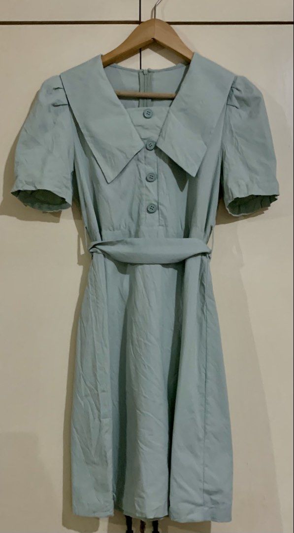 Light Blue Peter Pan Collar Button Up Dress with Belt (Category: Dresses) located in Paranaque City. Submitted by vbvessentials (Listing ID 1452829309, Image 1). Description: - Adorable light green dress - Features a charming Peter Pan collar - Button details down the front - Comes with a matching belt to cinch the waist - Short, cute puff sleeves - Ideal for casual days or picnics - Measurements: Chest 32-34 inches, Length 34 inches -ideal for p